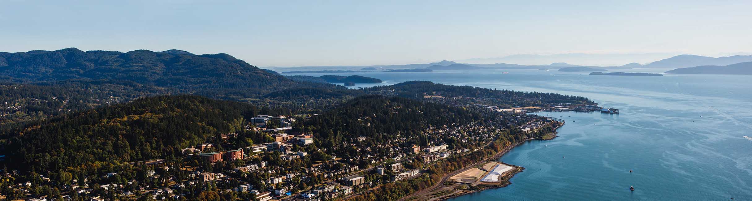 Bellingham Bay coastline with hills covered in trees and buildings